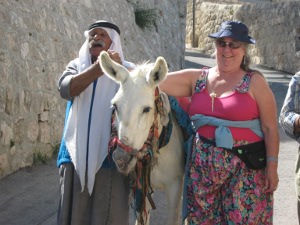 An Arab man meets us with his donkey on the Mount of Olives
